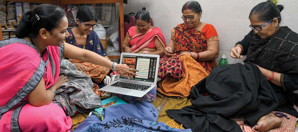 Artisans discussing embroidery